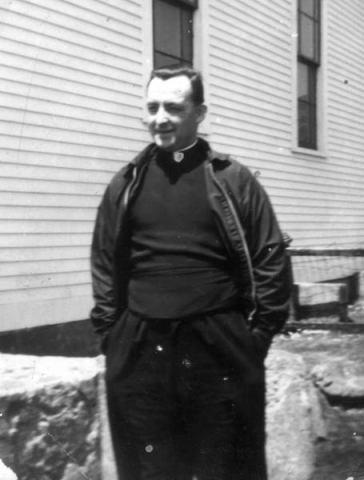 281: Fr. Phil Lewis in front of the church at Red Island. [courtesy of Lorraine Kerrivan]